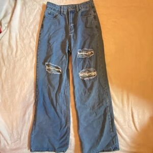 Ripped baggy blue jeans